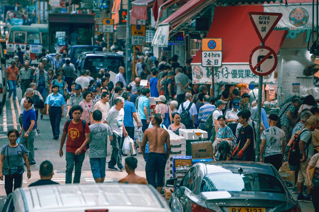 people on the street in a busy market