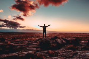 Man celebrating on a mountain top